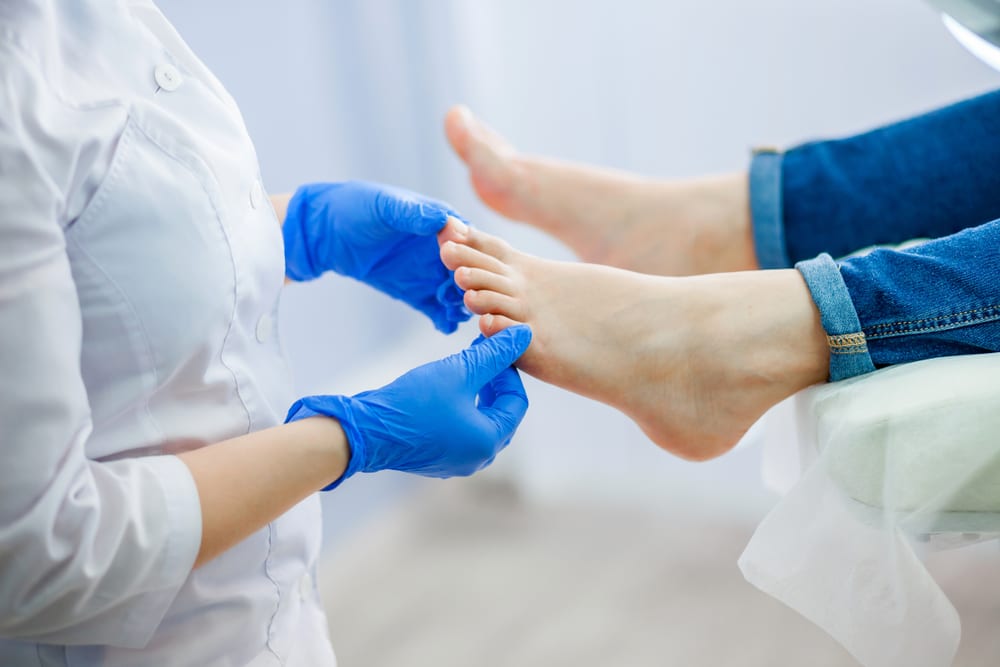 Doctor working with foot