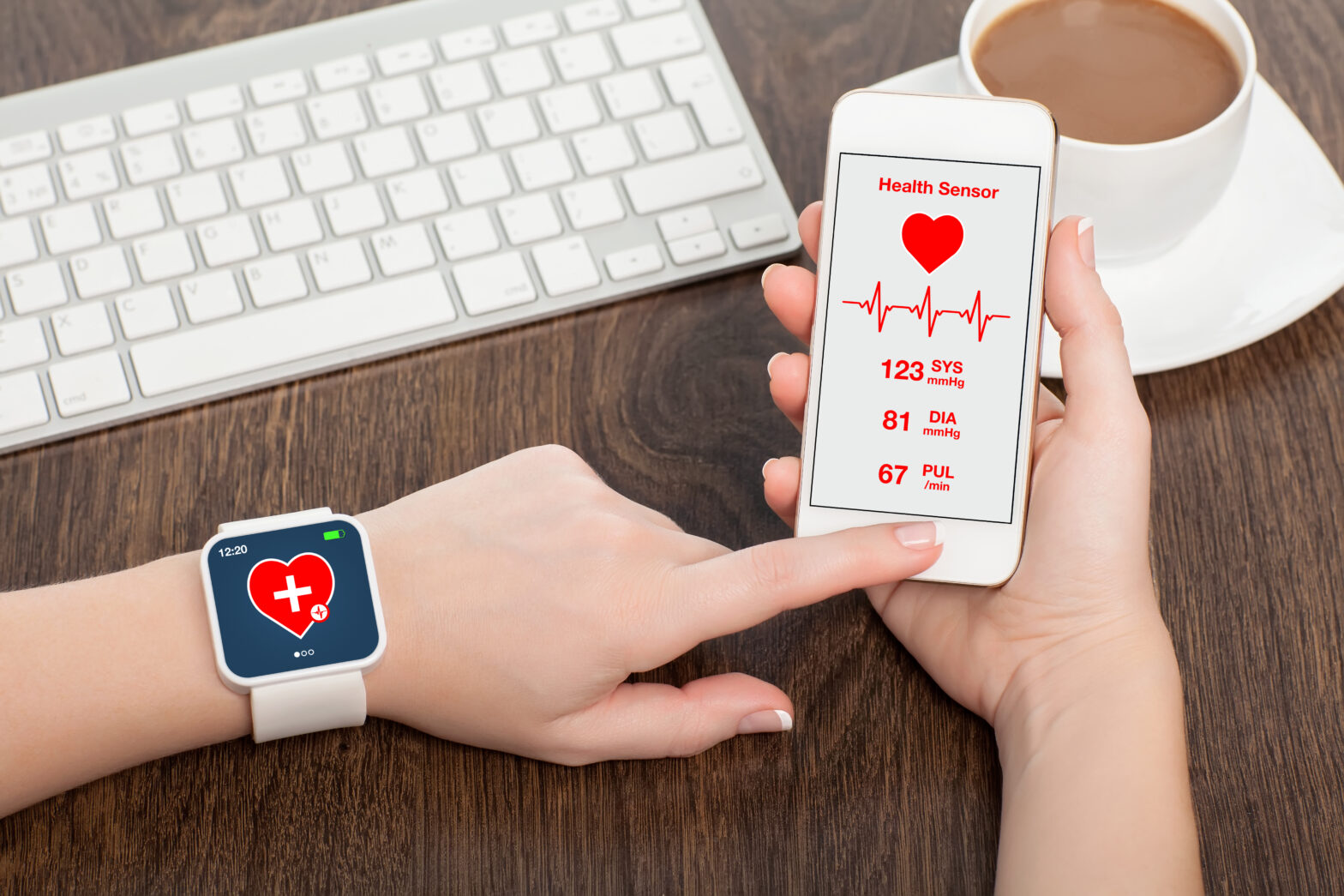 Patient wearing a smartwatch checking an app on a mobile phone